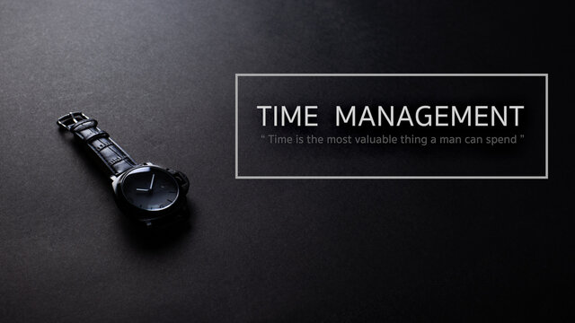 Black iron watch with black leather stap on black texture background, desk from top view, time mamagement concept