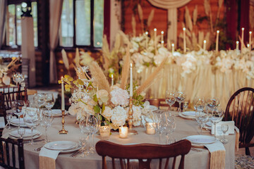 rustic wedding decorations with flowers and candles. banquet decor. picture with soft focus