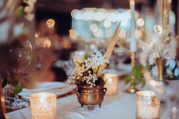 rustic wedding decorations with flowers and candles. banquet decor. picture with soft focus