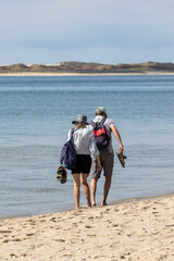 family walk on the beach