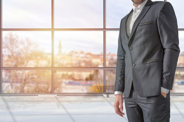 Man in elegant custom tailored expensive suit posing in the office