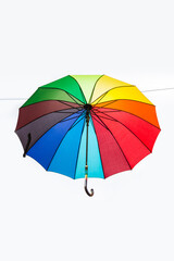 Rainbow umbrella isolated on white background