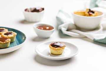 Caramel chocolate cookies on white and green plate. Concept of food decoration.