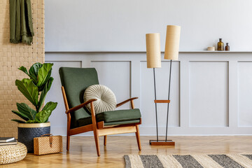 Minimalistic composition at living room interior with design green armchair, beige panel, plants,...