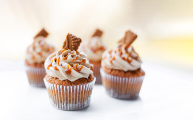 Brown caramel cupcakes on table