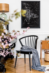 Stylish composition at living room interior with black piano, design chair, black mock up poster map, spring flowers, lamp, furniture and elegant presonal accessories in modern home decor.