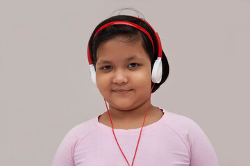 Girl listening to music on headphones
