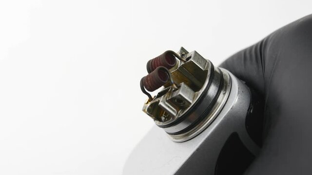 Vaping atomizer with clapton coil is working. Vape device or cigarette.