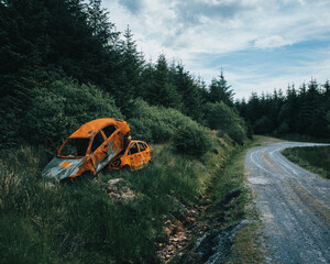 scrap car on the  forest road
