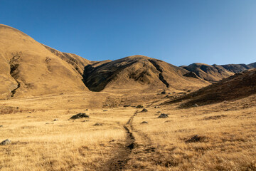 dramatic mountain hiking landscape in Juta trekking area landscape in autumn -  popular trekking  in the Caucasus mountains, Kazbegi region, Georgia.