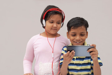 Happy Kids using a smart phone
