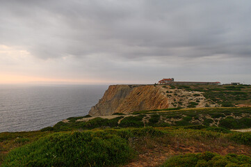 Fototapeta na wymiar Old church in Portugal on a hill by the ocean at sunset.