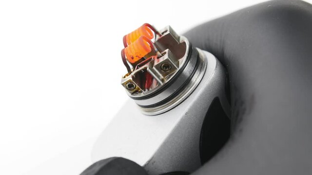 Vaping atomizer with clapton coil is working. Vape device or cigarette.