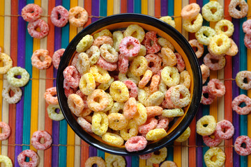 colorful ring corn flakes in a bowl on table 