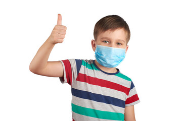 Young teen boy wearing medical mask and shows thumbs up Wearing a medical mask is good. corona virus concept. isolated on white background