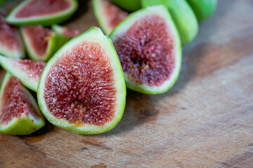Fig - fresh figs and sliced fig fruits close-up showing texture on cutting board