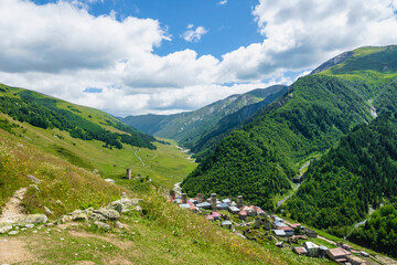 Fototapeta na wymiar Svaneti mountain and village landscape at the trekking and hiking route near Mestia village in Svaneti region, UNESCO heritage area in Georgia.