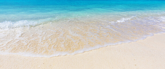 turquoise sea and soft waves surf on sandy beach, summer vacation on tropical island