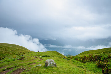 Kazbegi, Georgia - Mountain landscape of Mount Kazbegi landscape with dramatic clouds up in the...