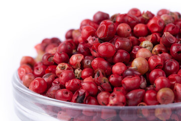 pink peppercorns in white natural spice