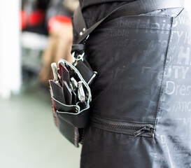 scissors of hairdressing in a holster or case