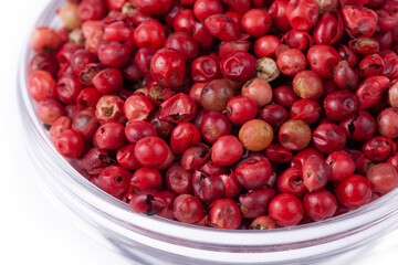 pink peppercorns in white natural spice