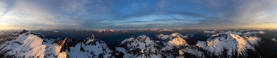 Aerial Panoramic View of Canadian Mountain Landscape, Tantalus Range, during a colorful sunset. Taken near Squamish, North of Vancouver, British Columbia, Canada. Nature Background Panorama
