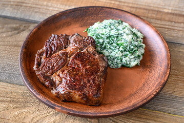 Beef steak with creamy spinach