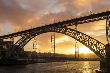 Luis I Bridge (Ponte) over Douro river in Porto, Portugal. Beautiful colorful sky at  sunset.