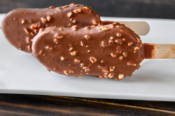 Chocolate-covered vanilla ice cream bar