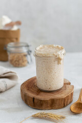 Active bubbly sourdough bread starter, healthy fermentation process on light table