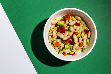 homemade bean salad with carrots, avocado, pepper