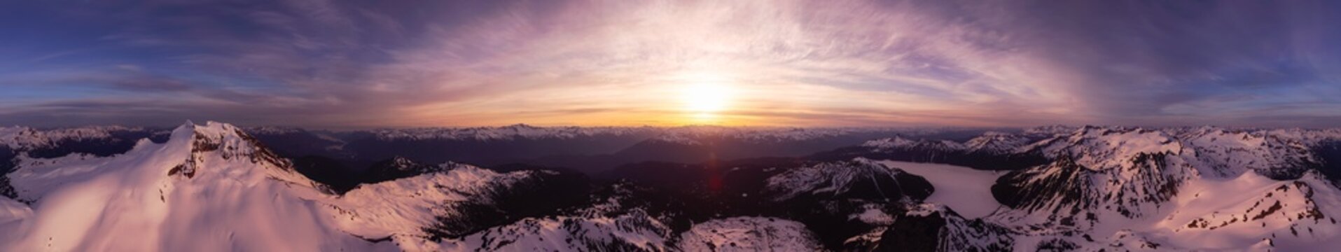 Aerial Panoramic View of Canadian Mountain Landscape during a colorful sunset. Taken in Garibaldi, near Whistler and Squamish, North of Vancouver, British Columbia, Canada. Nature Background Panorama