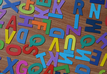 Colorful wooden alphabet on table