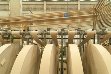 Paper tube cores, steel metal machine engine, technology manufacturer in operation process in industry manufacturing plant factory. Raw product equipment. Cardboard cargo in workshop warehouse