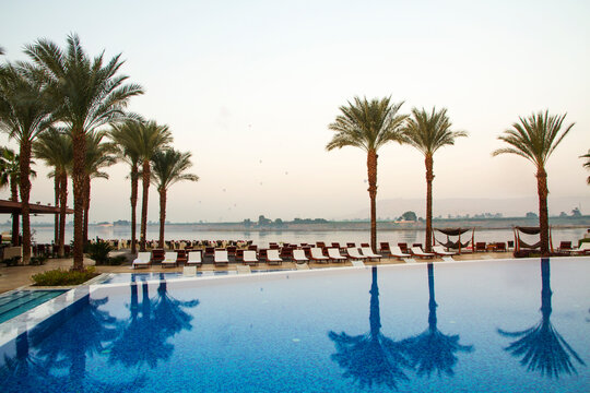 Nile river at sunrise with hot air balloons in Luxor, Egypt.

