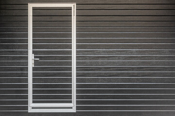 closed brown roller shutter door, gates to the garage. security in a modern building.