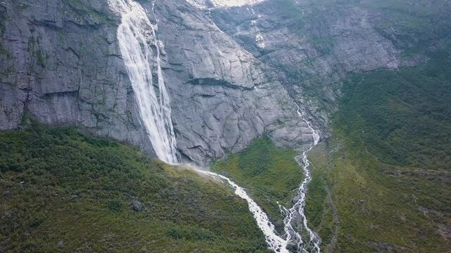 Waterfall of a melting glacier at Briksdalsbreen glaicer in the national park of Jostedalsbreen in nature of Norway
