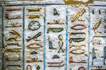 Burial chamber with colorful Egyptian hieroglyphics at the valley of the kings, Luxor, Egypt