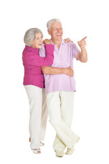 Senior couple pointing isolated on white background