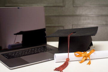 Graduation cap with laptop computer , Online education concept