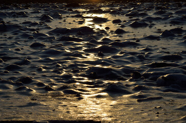 morning sun reflection on deep frozen sea shore background
