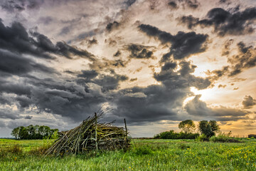 landscape in cloudy weather with a sunset, spring