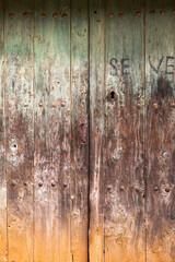 Old rustic wooden door with cracked paint