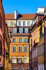 Warsaw, Mazovia / Poland - 2020/05/10: Colorful tenement houses of historic Old Town quarter - Stare Miasto - along Krzywe Kolo and Nowomiejska streets in Warsaw, Poland © Art Media Factory