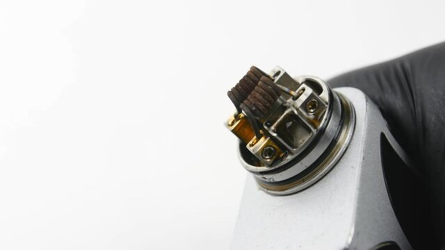Vaping atomizer with clapton coil is working. Vape device or cigarette.