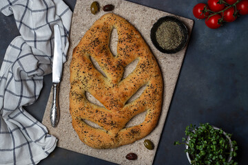 Fugasse bread with sesame seeds and herbs