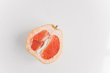 sliced grapefruit on a white background