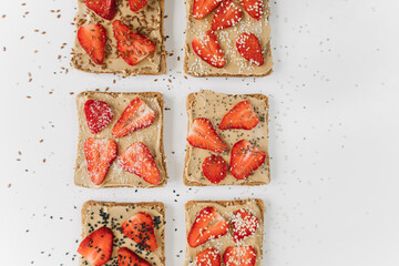 toast bread with peanut paste and strawberries