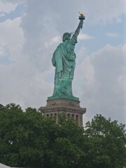 Fototapeta na wymiar statue of liberty island new york skyline